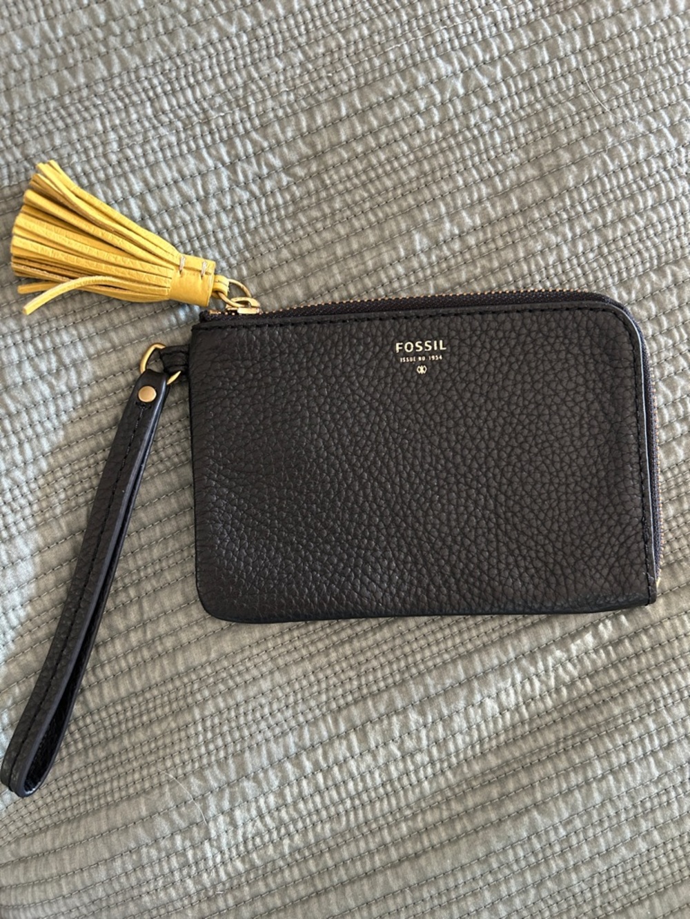 Fossil Tara Black Pebbled Leather Wristlet with Yellow Tassel Accent